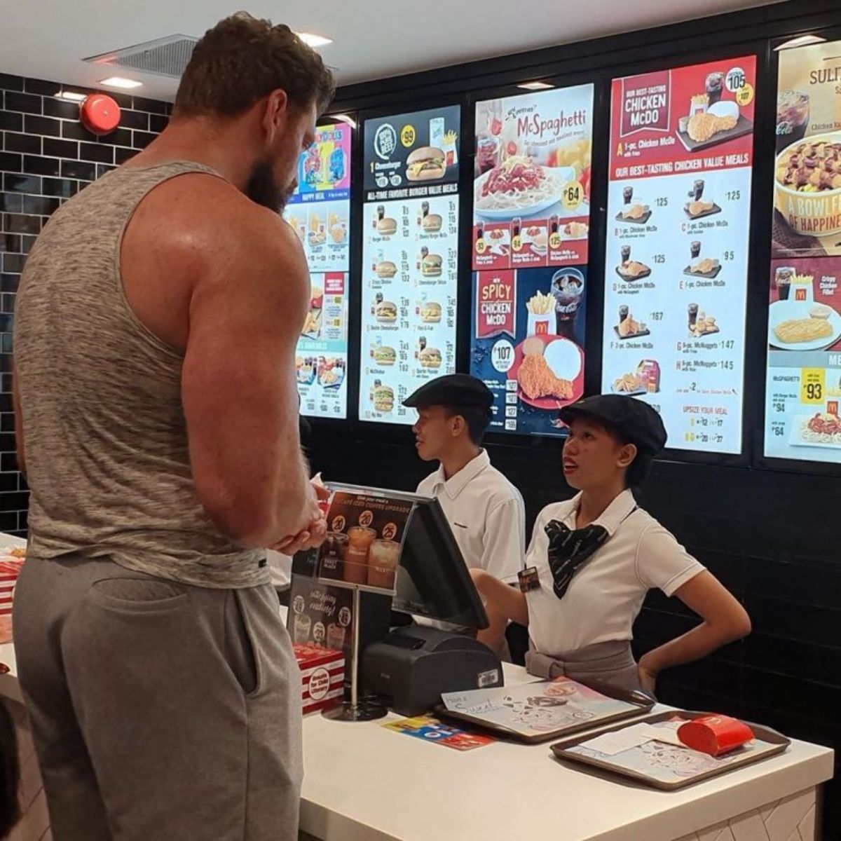 Huge swole man ordering food