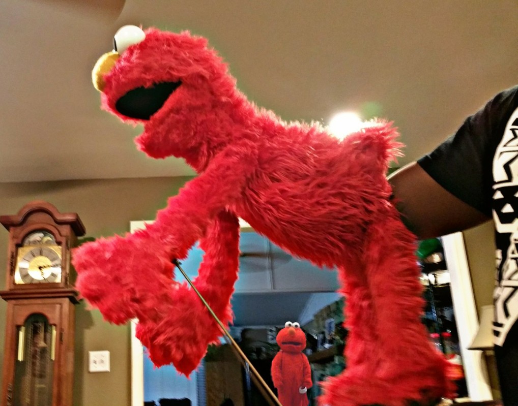 Elmo getting fisted while another Elmo watches in horror