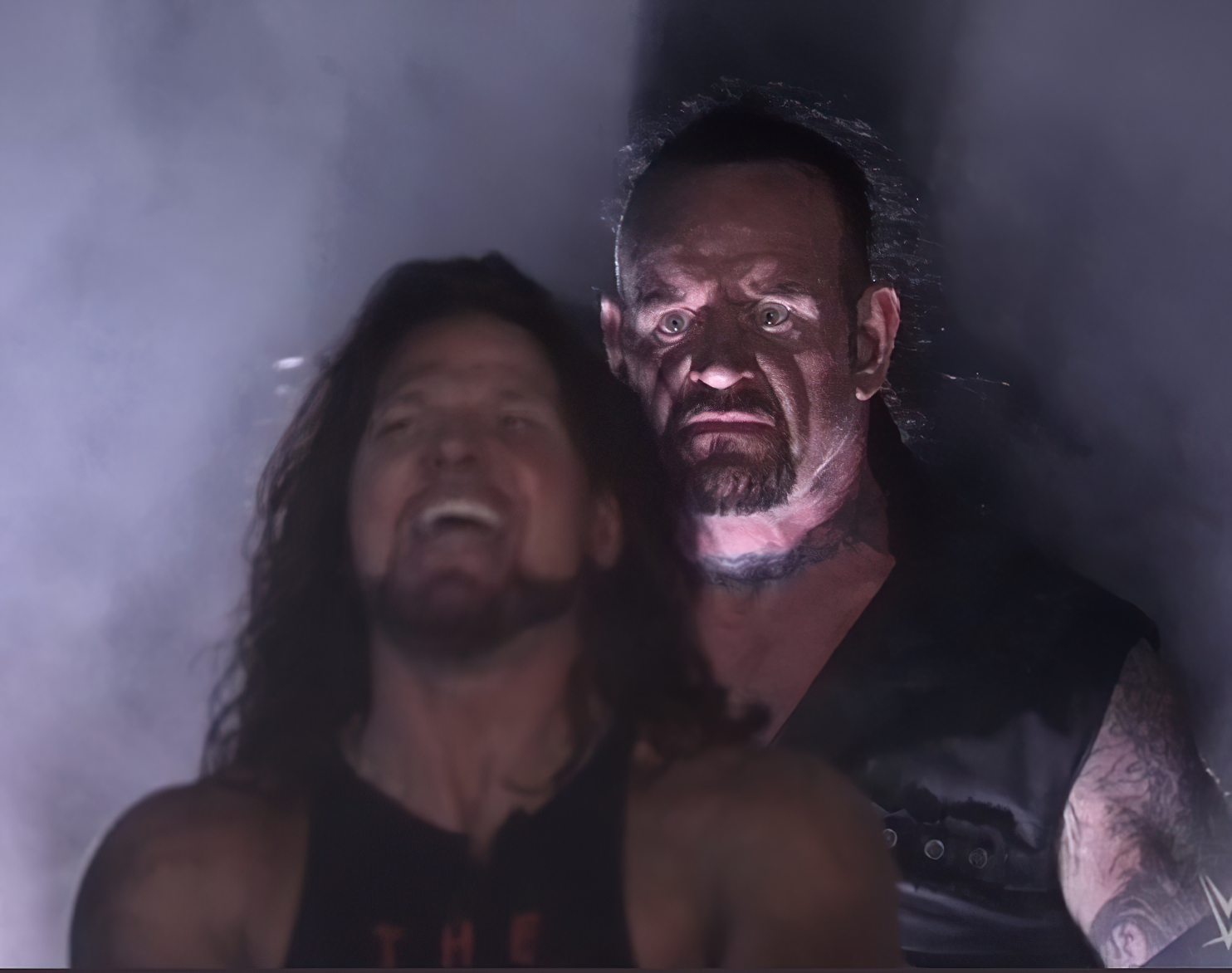 Undertaker standing behind catch wwe