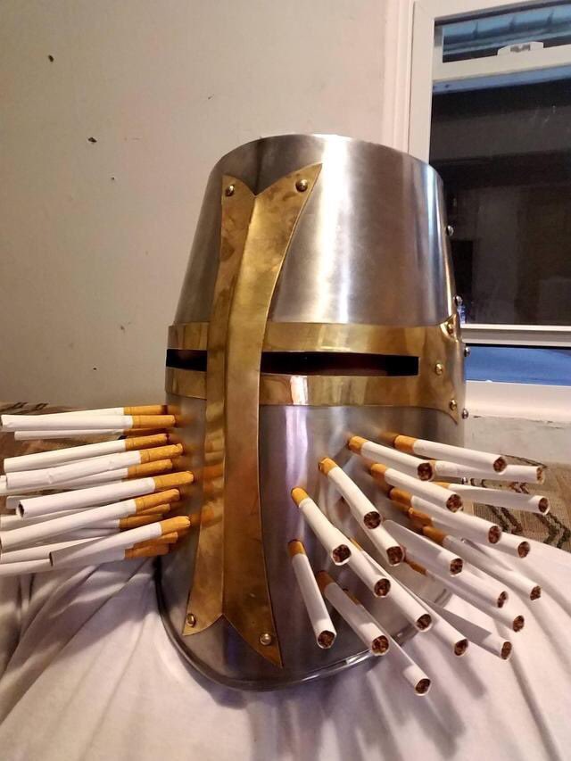 Knight Smoking Cigarettes Through Helmet - Chevalier