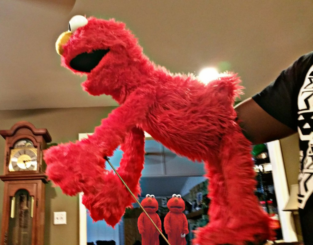Elmo getting fisted while two other Elmos watches in horror